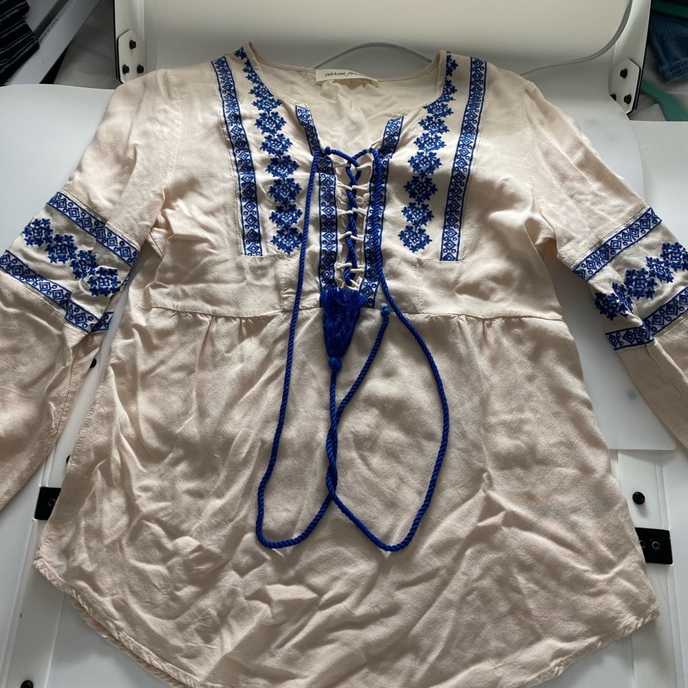Caren Forbes beige blouse with blue stitching